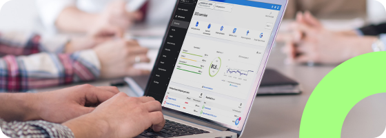 A person using a computer. The SEO dashboard of the Siteimprove platform is showing on the screen.